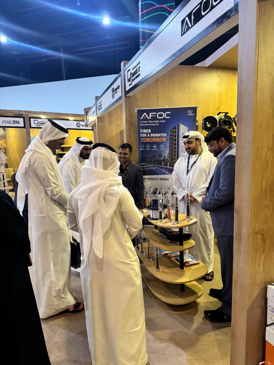 Visitors viewing the AFOC product range display of fiber optic cable samples