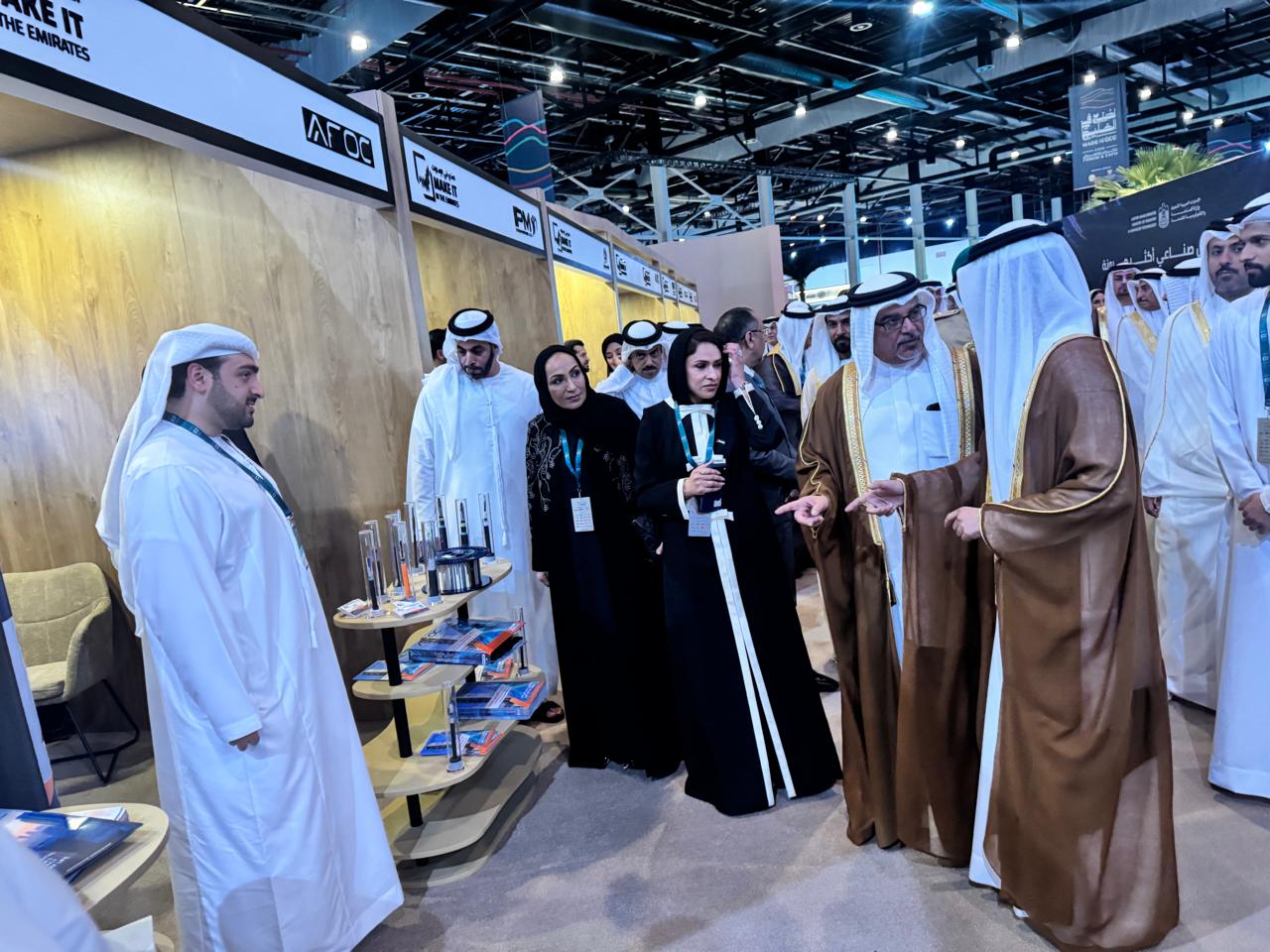 Official delegation touring the UAE Pavilion and passing the AFOC stand